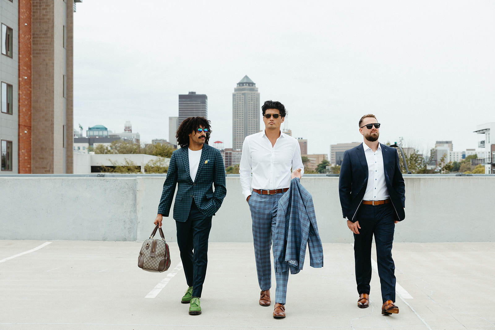 Three clients in custom Langel & Woods clothing walking a downtown street