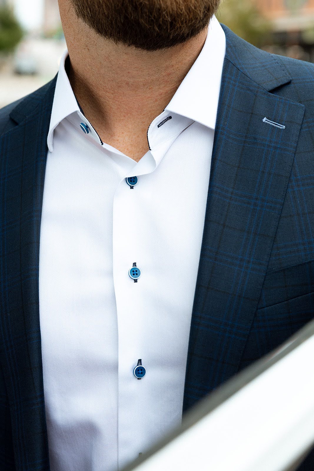 Custom white dress shirt with contrast blue buttons
