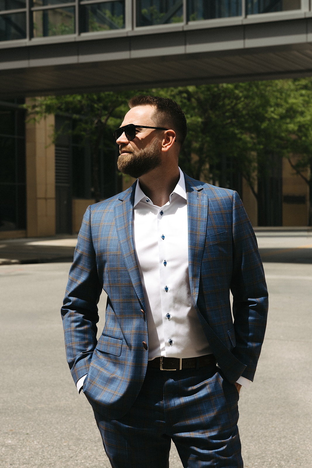 Man in a custom navy plaid suit