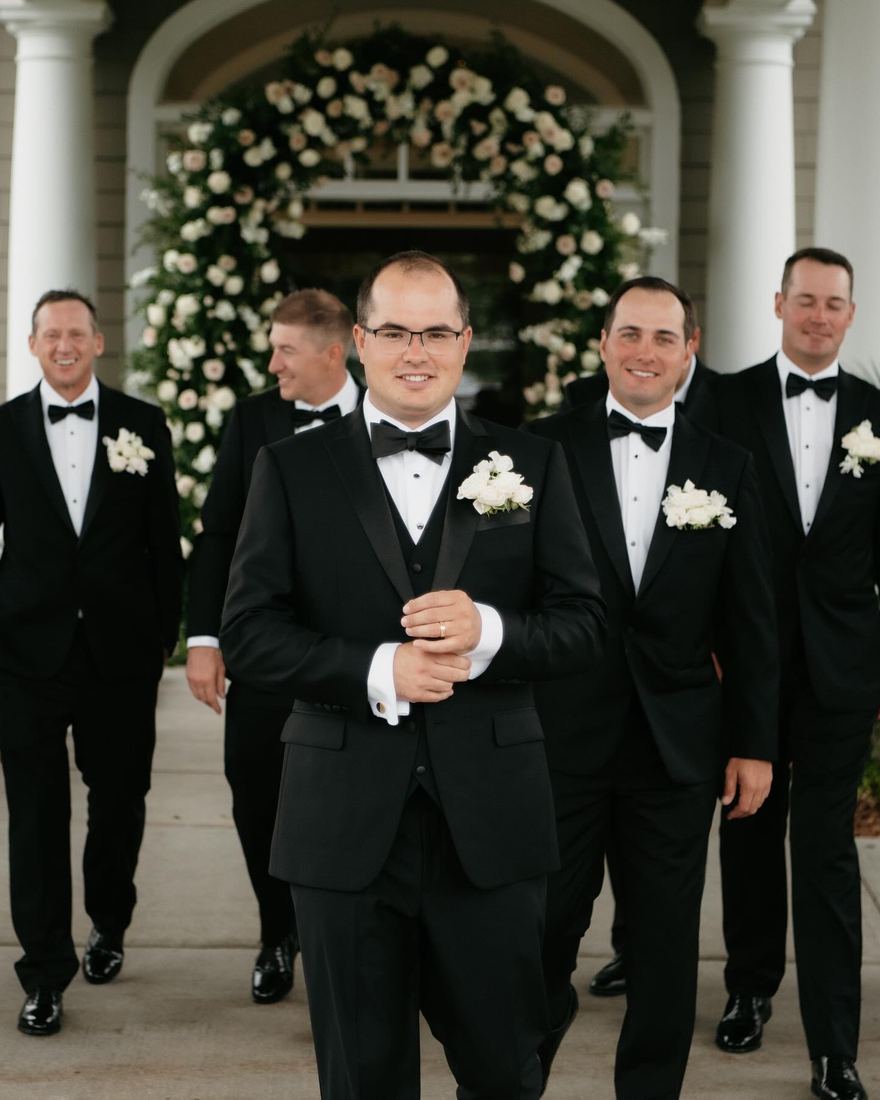 Groom and groomsmen in custom tuxedos