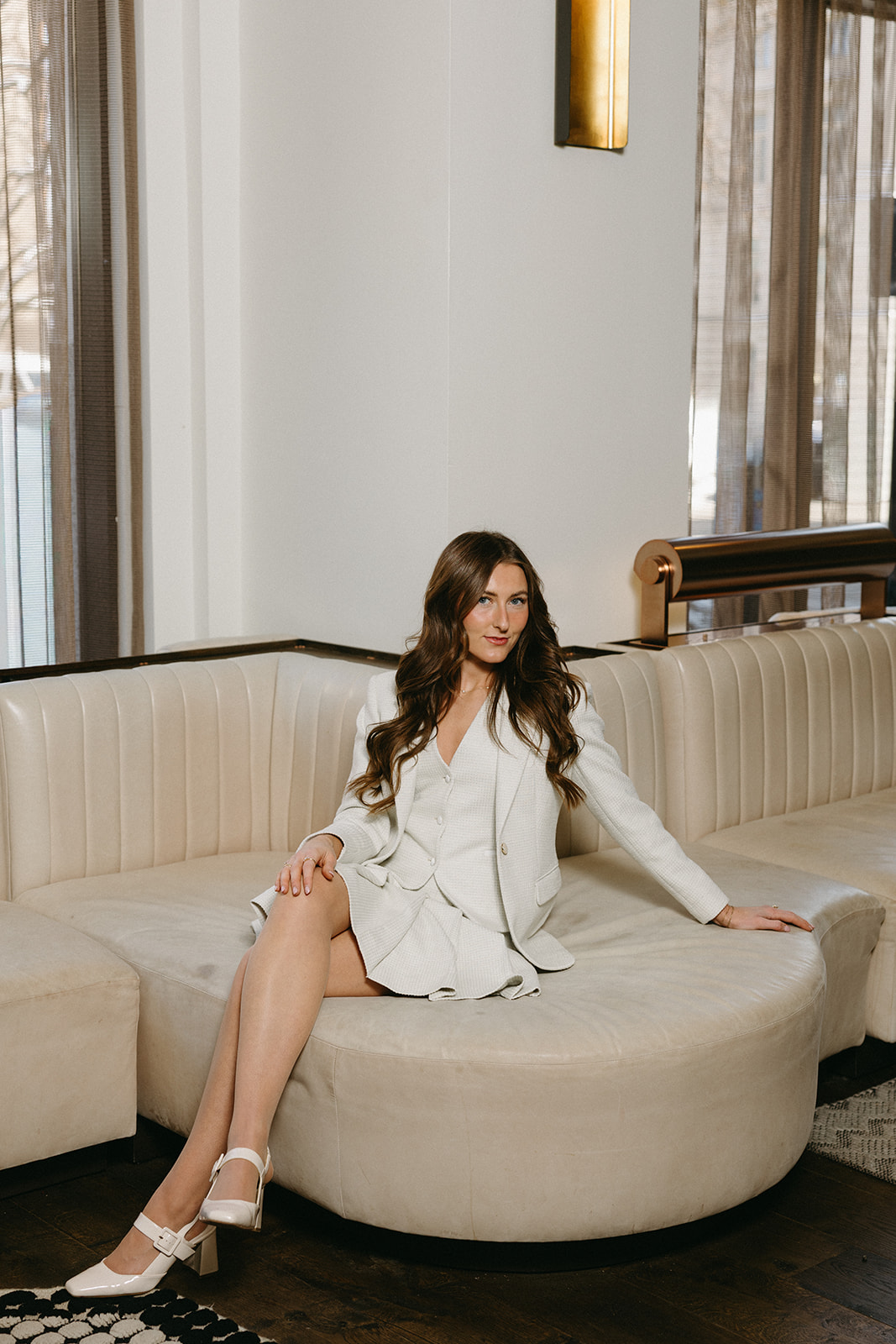 Woman in a custom white bridal blazer and dress