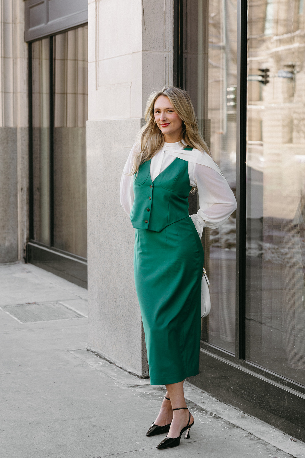 Woman in a custom green midi dress